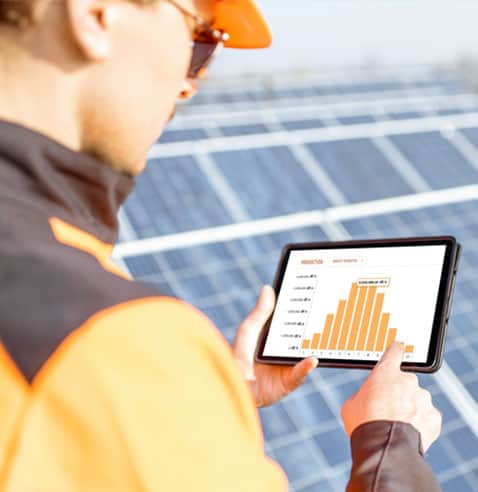 solar service technician reviewing performance of a commercial solar system